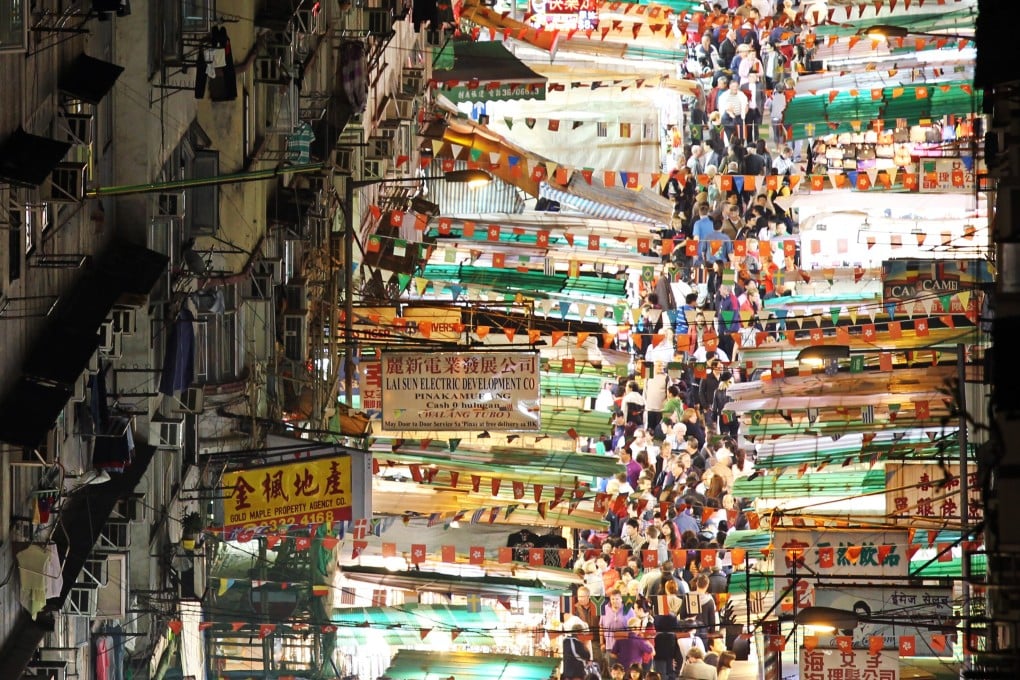 The lights of Kowloon’s famous Temple Street Night Market shine brightly in 2012. Shop and stall owners there and at Stanley Market, tourist magnets for five decades, fear they will have to close because visitor numbers have plummeted. because of the coronavirus pandemic and anti-government protests in the city. Photo: Dickson Lee