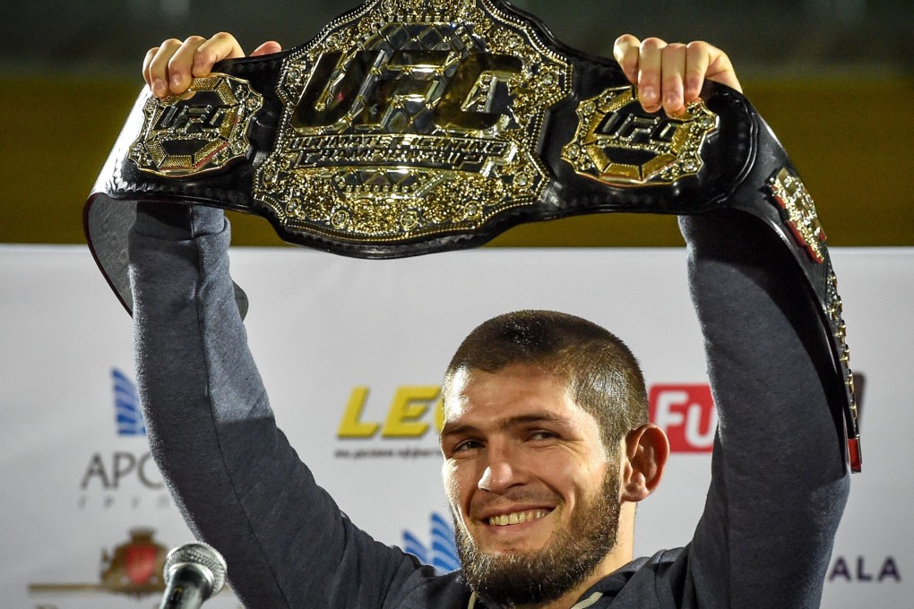 UFC lightweight champion Khabib Nurmagomedov raises his belt in Makhachkala, Russia in 2018. Photo: AFP