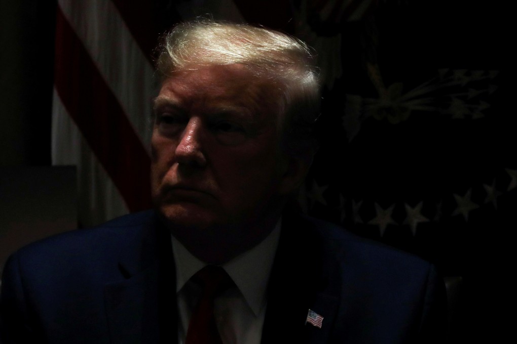 US President Donald Trump listens during a meeting about coronavirus pandemic response in the White House on May 20. Photo: Reuters