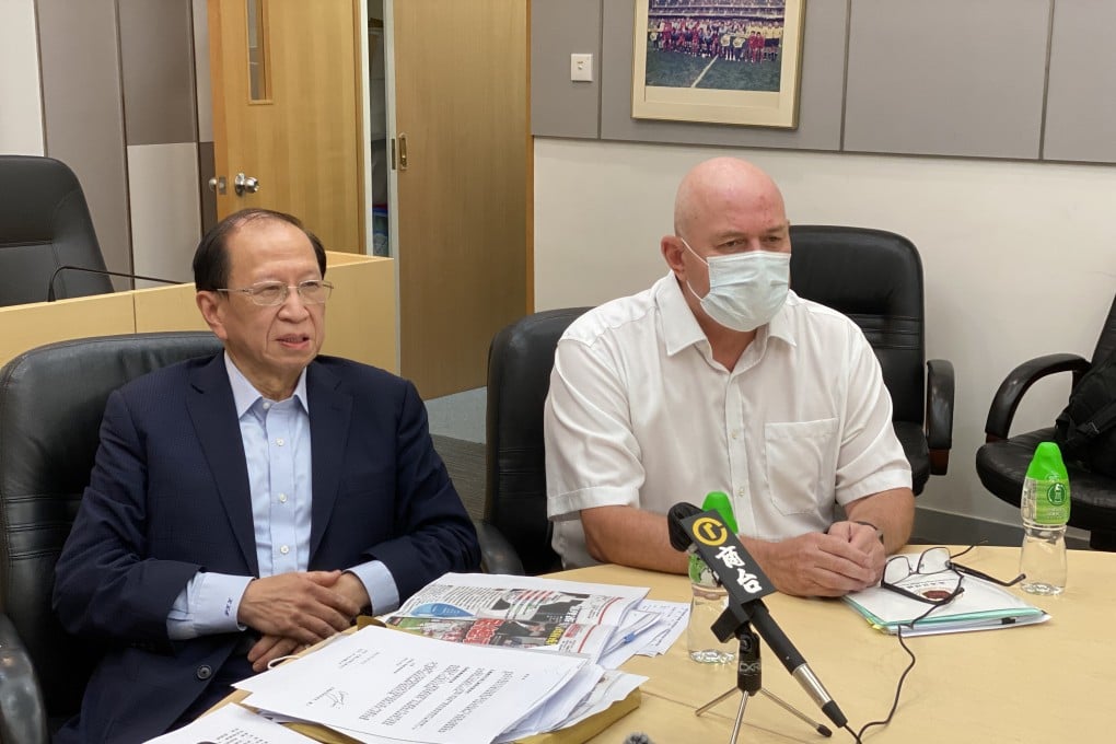 HKFA chairman Pui Kwan-kay and chief executive Paul Woodland, who will leave the association next month. Photo: Chan Kin-wa