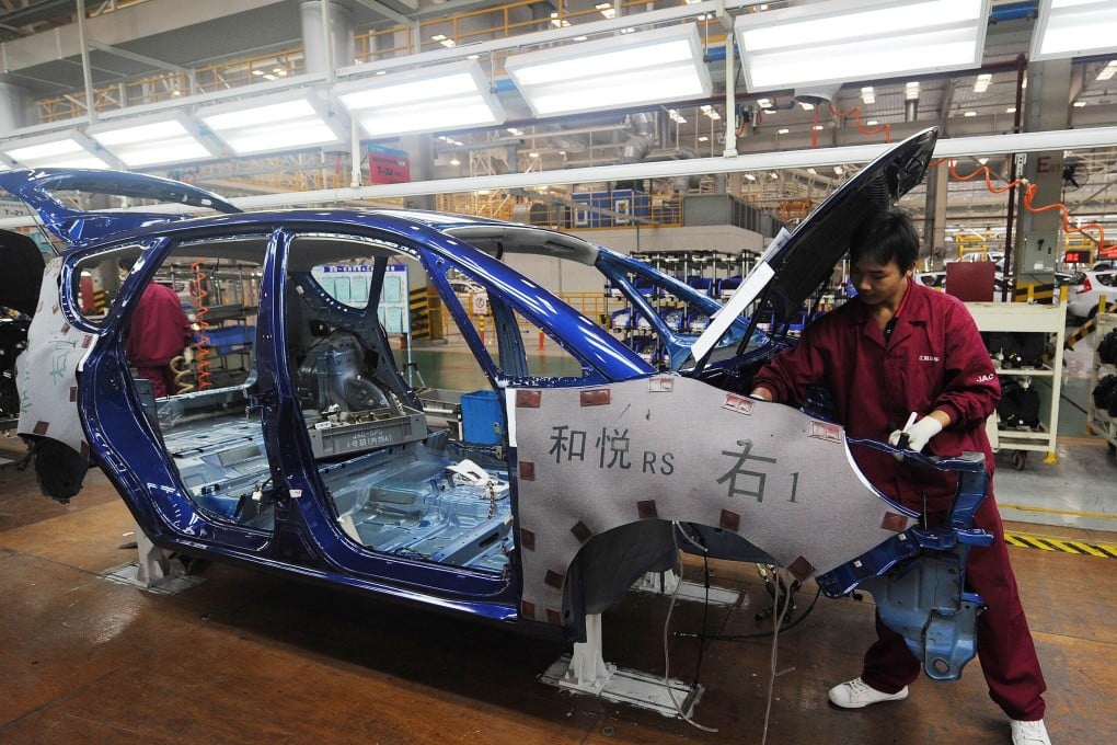 Workers at the Jianghuai Automobile Group’s plant in the Anhui provincial capital of Hefei in eastern China on November 10, 2010. Photo: AFP