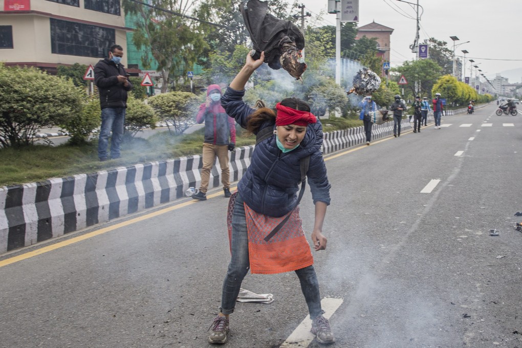 A Nepalese activist burns an image of Indian Prime Minister Narendra Modi during a protest in Kathmandu, Nepal. Photo: EPA