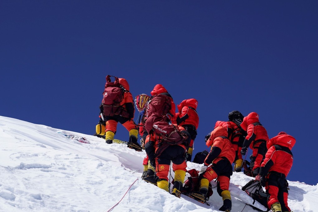 The Chinese survey team reaches the summit of Mount Everest on Wednesday after a nine-hour climb. Photo: Xinhua