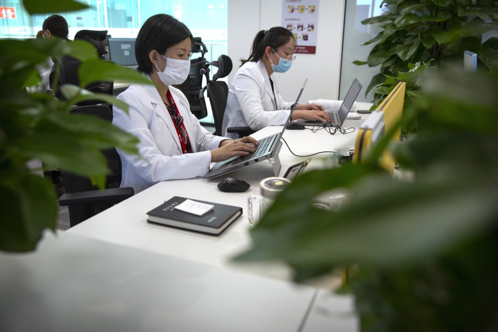 JD Health doctors use computers to chat online as they consult with patients at the JD.com headquarters in Beijing, Friday, March 27, 2020. Photo: AP