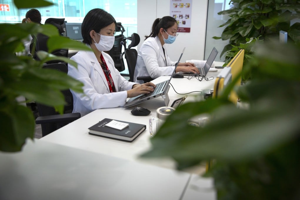JD Health doctors use computers to chat online as they consult with patients at the JD.com headquarters in Beijing, Friday, March 27, 2020. Photo: AP