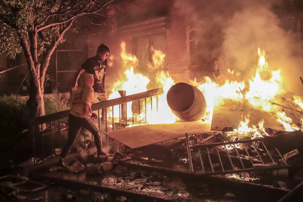 Protesters burn the Minneapolis Police Department 3rd Precinct as anger over the death of an unarmed black man, George Floyd, in police custody continues. Photo: EPA-EFE