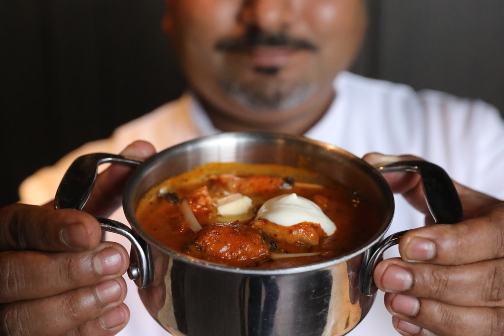 The story of butter chicken – like this one held by Hong Kong chef Palash Mitra – is one of three hard-working refugees, a hugely popular Delhi restaurant and an accidental flavour combination born out of necessity and leftover tandoori chicken. Photo: K.Y. Cheng