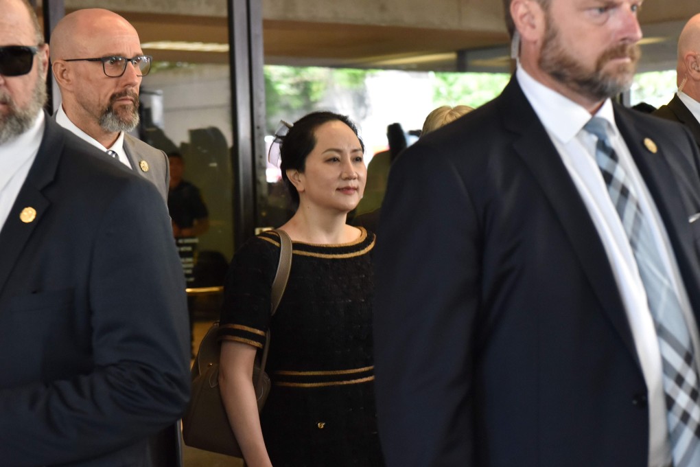 Huawei Chief Financial Officer, Meng Wanzhou (centre), leaves British Columbia Supreme Court, after hearing the decision of her double-criminality judgment in Vancouver. Photo: AFP