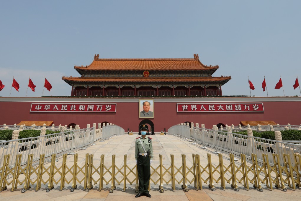 An armed policeman stands in front of the Tiananmen Rostrum in Beijing on May 22, the first day of the third session of the 13th National People’s Congress, China’s top legislative body. The central government submitted a resolution to the NPC to enable its standing committee to pass a new national security law tailor-made for Hong Kong. Photo: Simon Song