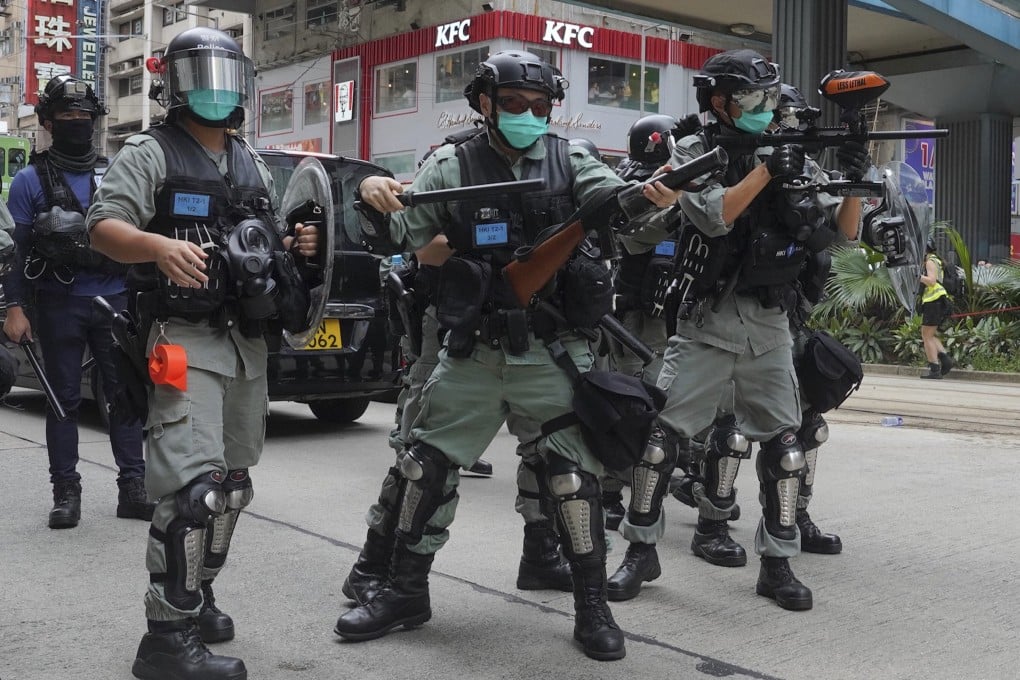 Riot police fire tear gas during a protest against Beijing’s national security legislation in Hong Kong. Photo: AP