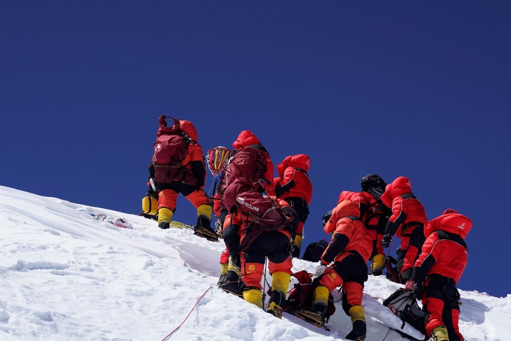 Members of a Chinese surveying team reach the summit of Mount Everest. Photo: Xinhua