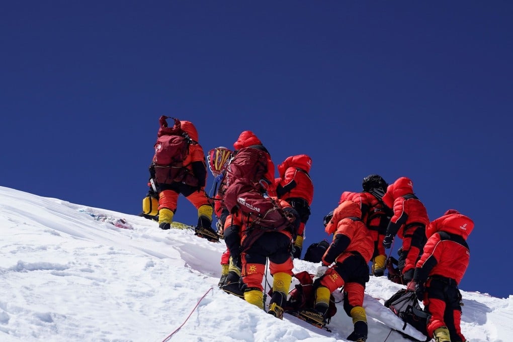 Members of a Chinese surveying team reach the summit of Mount Everest. Photo: Xinhua