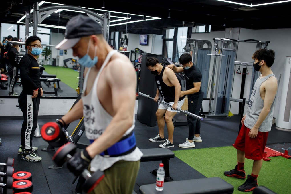 Members exercise at a Beijing gym earlier this month after lockdown restrictions were eased. Photo: Reuters