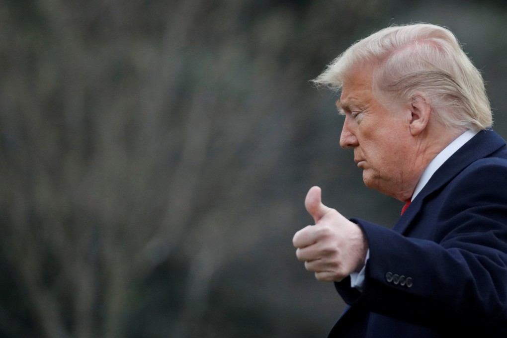 US President Donald Trump gestures to reporters from the White House lawn on March 5. Photo: Reuters