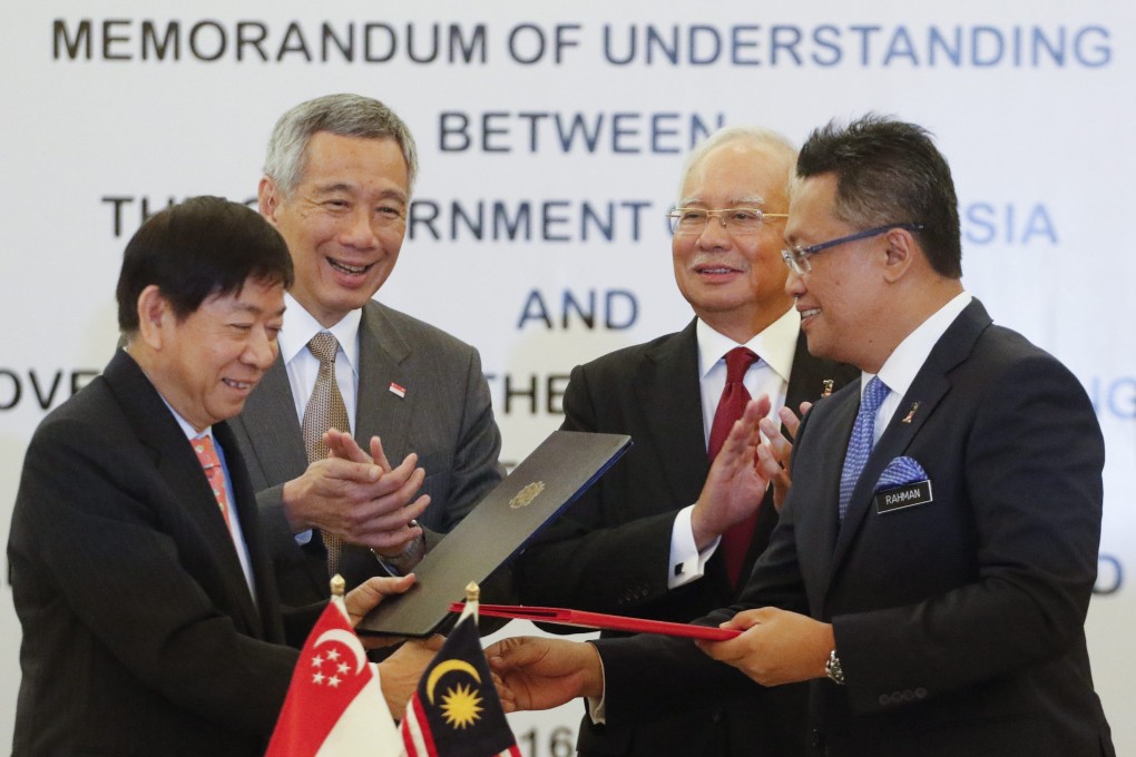 Singapore’s Transport Minister Khaw Boon Wan, left, and Prime Minister Lee Hsien Loong with then- Malaysian Prime Minister Najib Razak and former minister Abdul Rahman Dahlan, right, at a signing ceremony in 2016 for the rail project. Photo: EPA