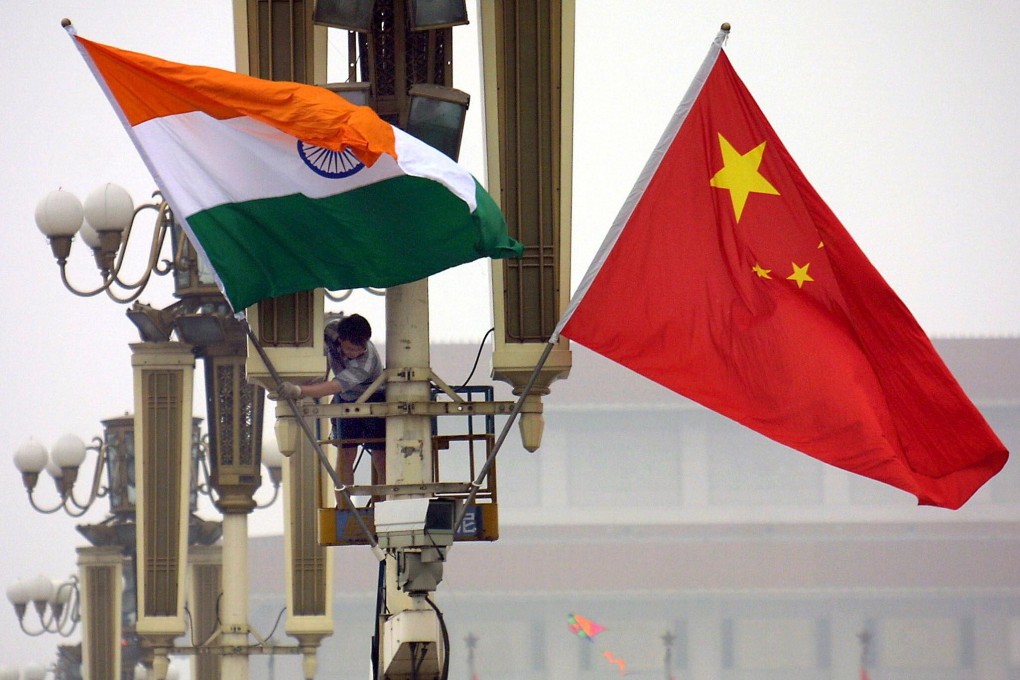 Indian and Chinese flags are seen in Beijing. Troops along the shared border have been locked in a tense stand-off for nearly a month, with India’s defence minister Rajnath Singh on Sunday admitting to tensions. Photo: AFP