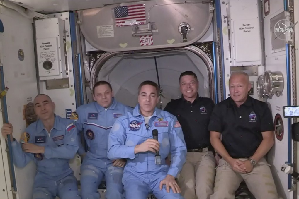 Bob Behnken and Doug Hurley, far right, joining the crew at the International Space Station. Photo: Nasa via AP