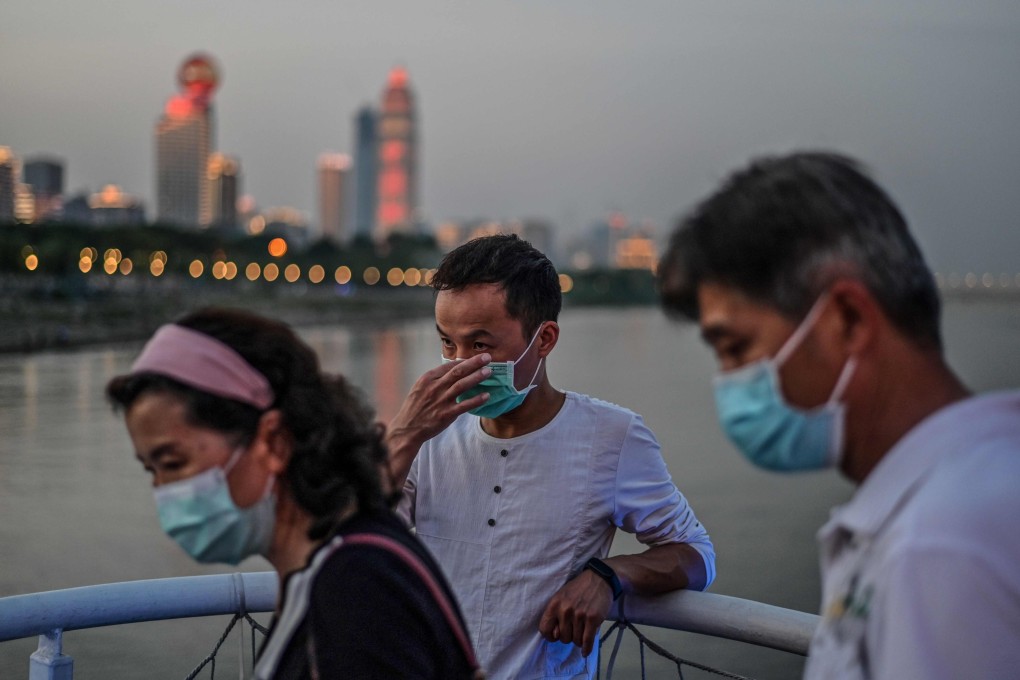 Warmer weather might allow for easing in some coronavirus measures in China, according to a top government adviser on the pandemic. Photo: AFP