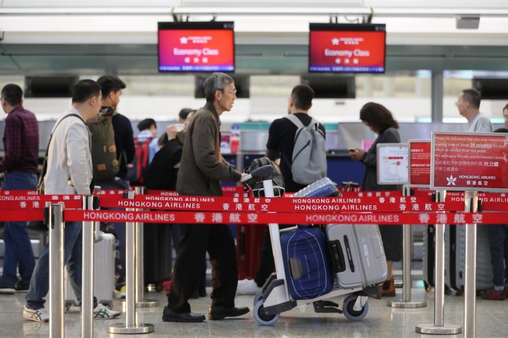 Passengers at the Hong Kong Airlines check in counter, Hong Kong International Airport, Chek Lap Kok on 29 November 2019. Photo: Edward Wong