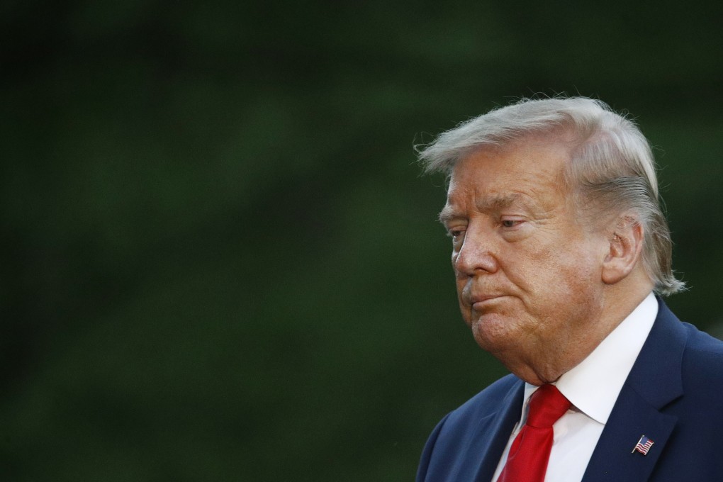 President Donald Trump walks across the South Lawn of the White House in Washington. Photo: AP Photo