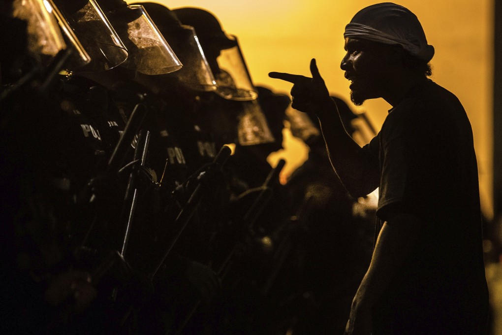 A protester confronts police in Tuscon, Arizona. Photo: AP