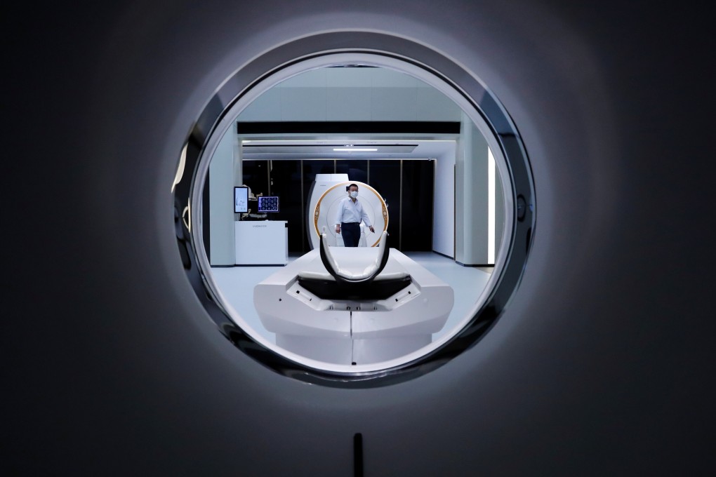 A man is seen through a CT scanner at the showroom of the medical imaging equipment maker Beijing Wandong WDM Medical Technology during a government organised tour of the facility following the outbreak of the new coronavirus, in Beijing on May 14, 2020. Photo: Reuters