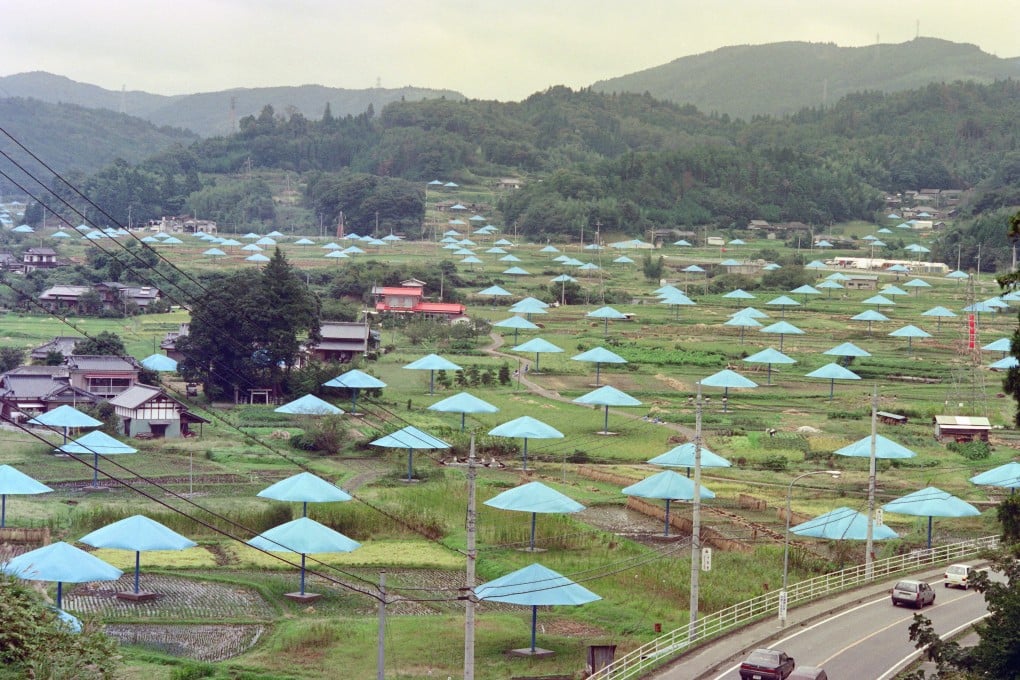 Giant umbrellas stand in the rice fields of Jimba village 120 km north of Tokyo, in 1991, as part of artists Christo and Jean-Claude’s public art project Umbrellas. The Bulgarian-born artist has died, aged 84. Photo: AFP