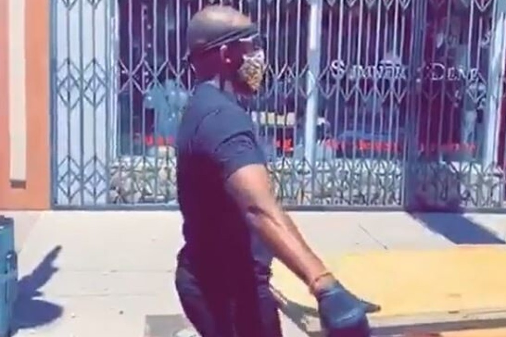Jon Jones helping put up boards in Albuquerque after the city was hit by rioters. Photo: Instagram/JonnyBones