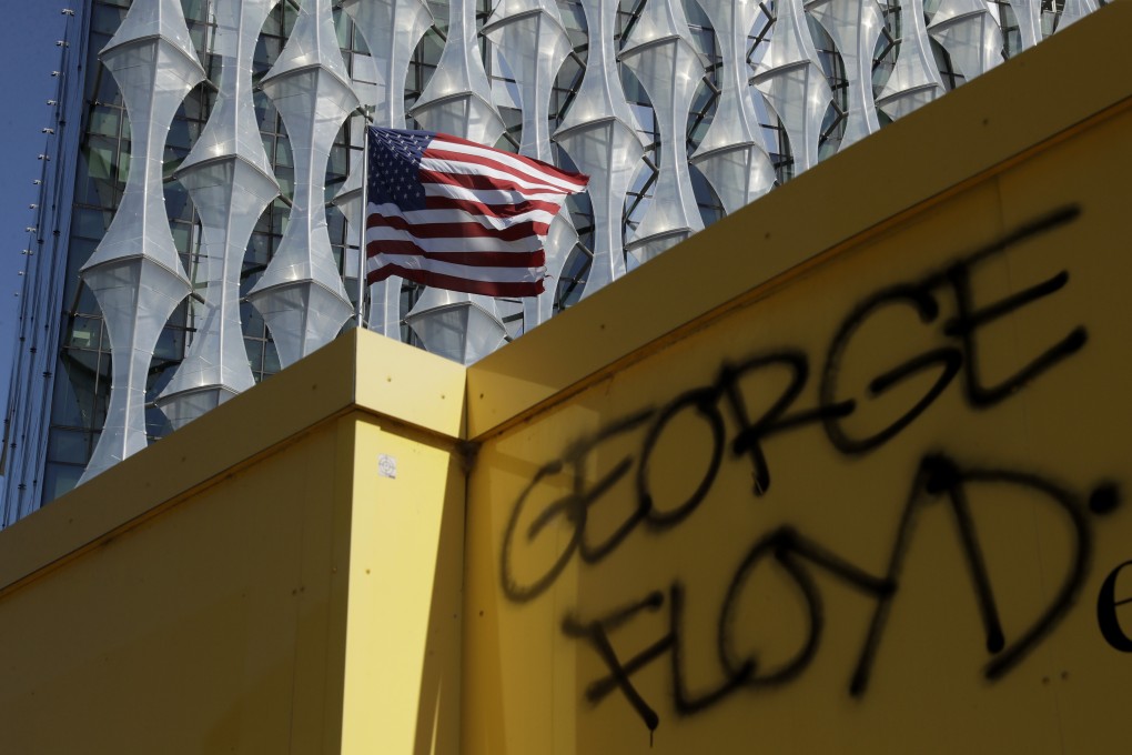 George Floyd's name was written outside the US embassy after people marched there from Trafalgar Square in central London. Photo: AP