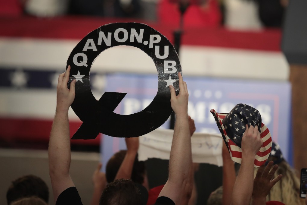 A QAnon sign at a rally for President Donald Trump in 2018. File photo: AFP