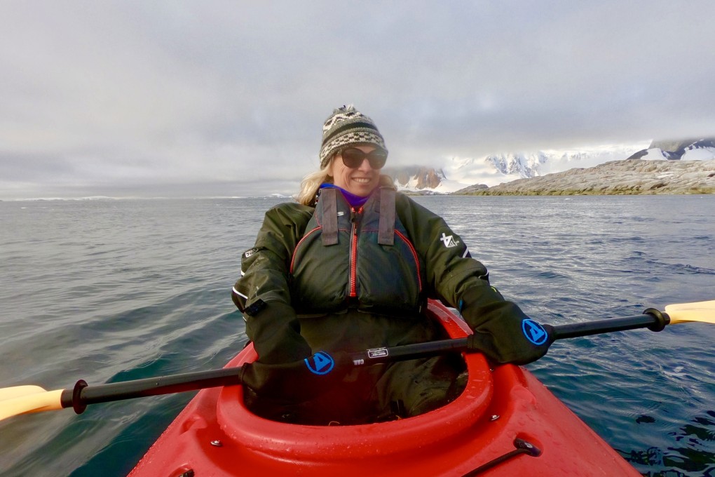 Writer Carolyn Beasley kayaking at Port Charcot in Antartica. Photo: Carolyn Beasley