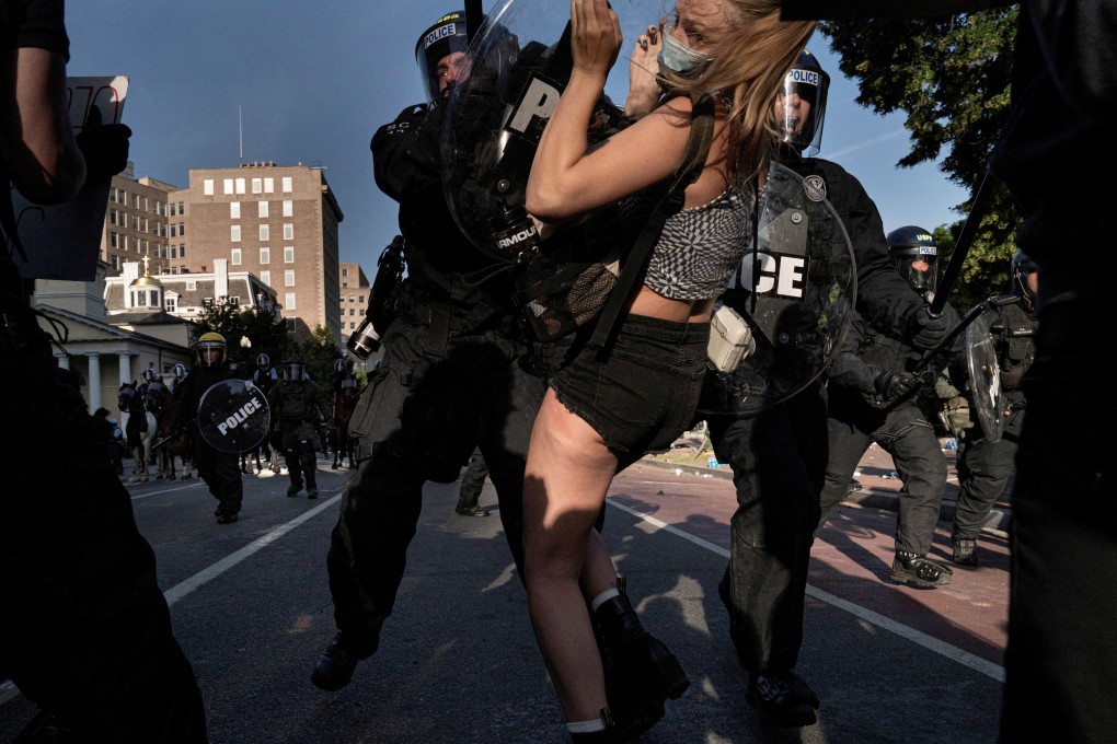 Riot police rush demonstrators as they clear Lafayette Park and the area around it across from the White House for President Donald Trump’s photo-op in front of St John's Episcopal Church on Monday. Photo: Reuters