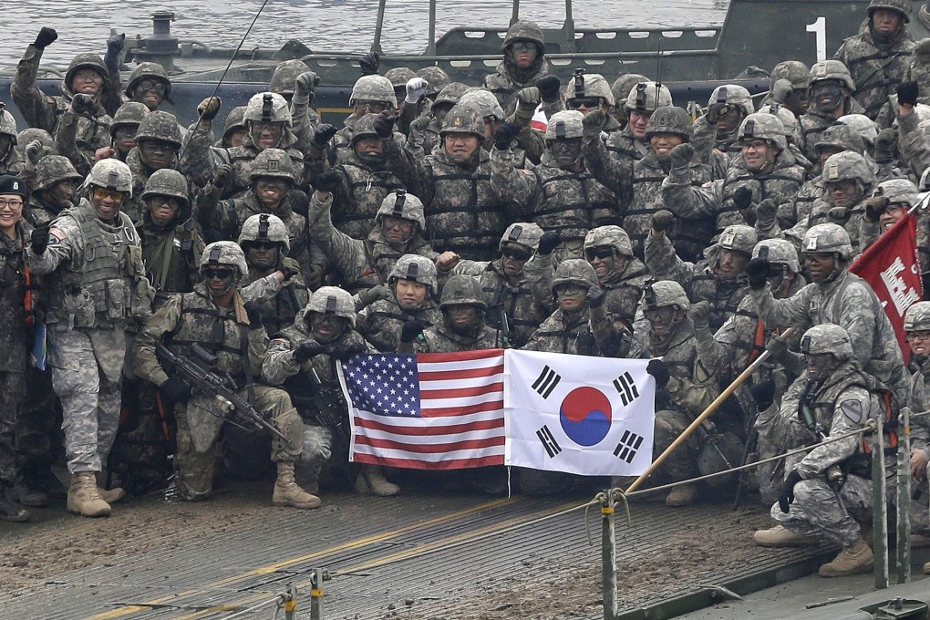 US and South Korean soldiers pose on a floating bridge on the Hantan river during a joint military exercise in 2015. Photo: AP