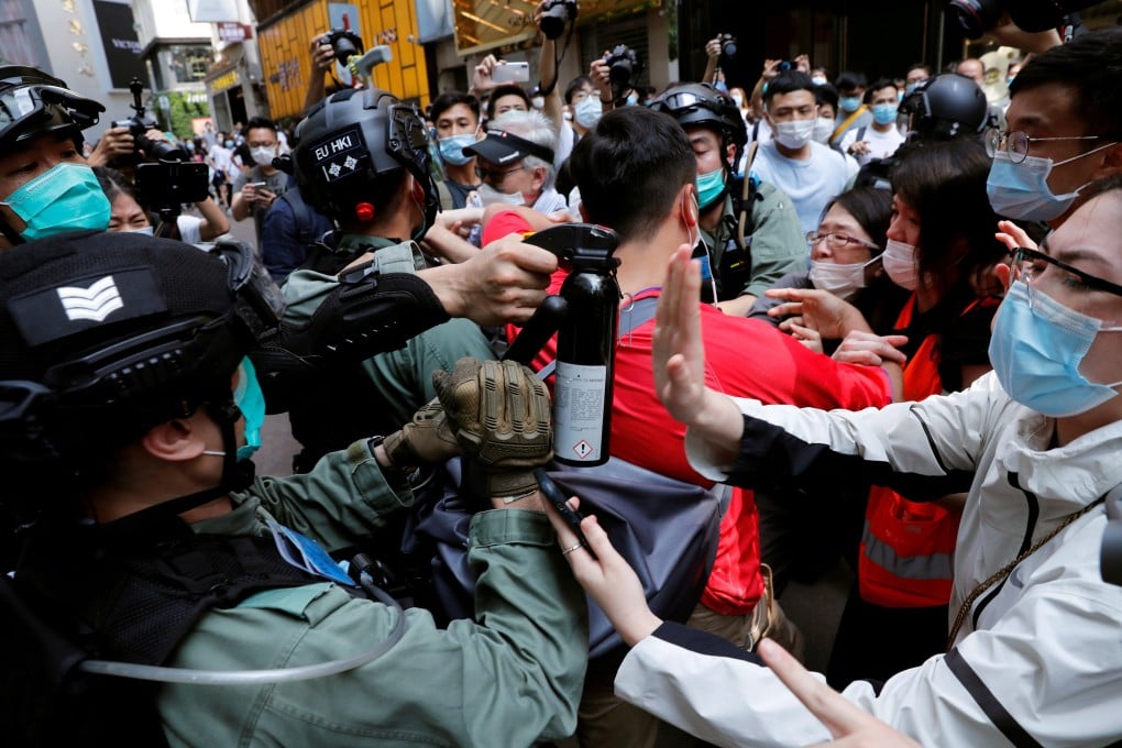 Demonstrators scuffle with riot police during a lunchtime protest as a second reading of a controversial national anthem law takes place in Hong Kong on May 27. Photo: Reuters