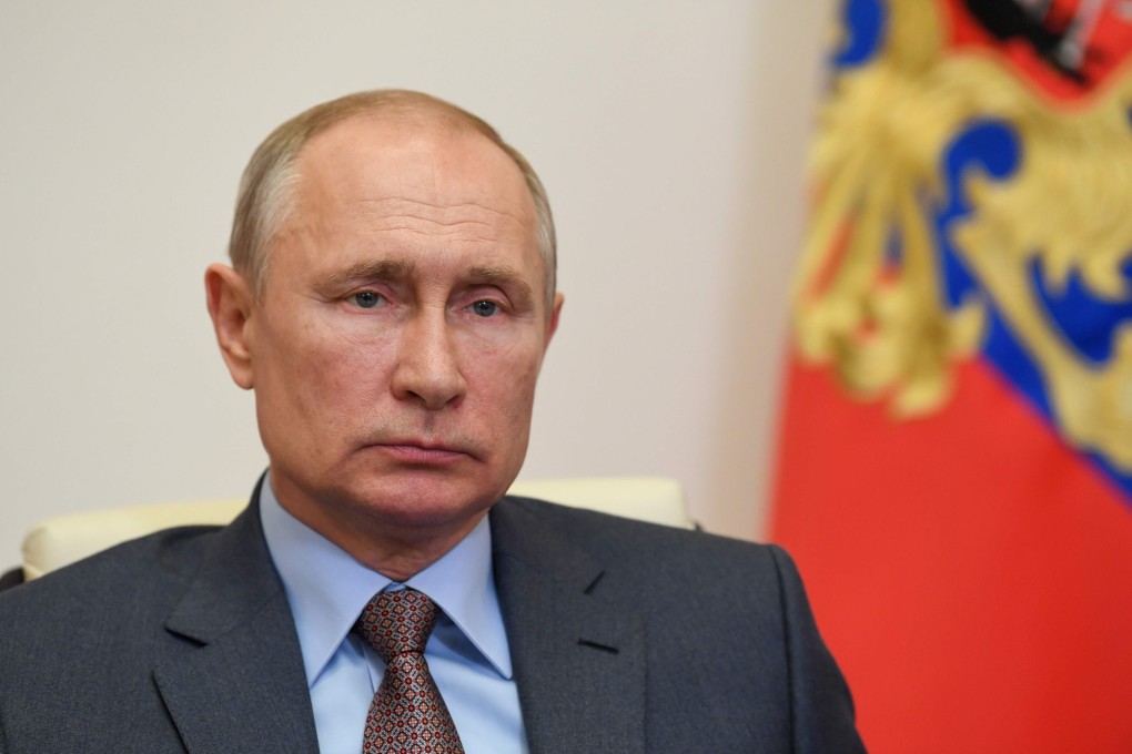 Russian President Vladimir Putin listens during a teleconference meeting while at the Novo-Ogaryovo state residence outside Moscow on Tuesday. Photo: Sputnik/AFP