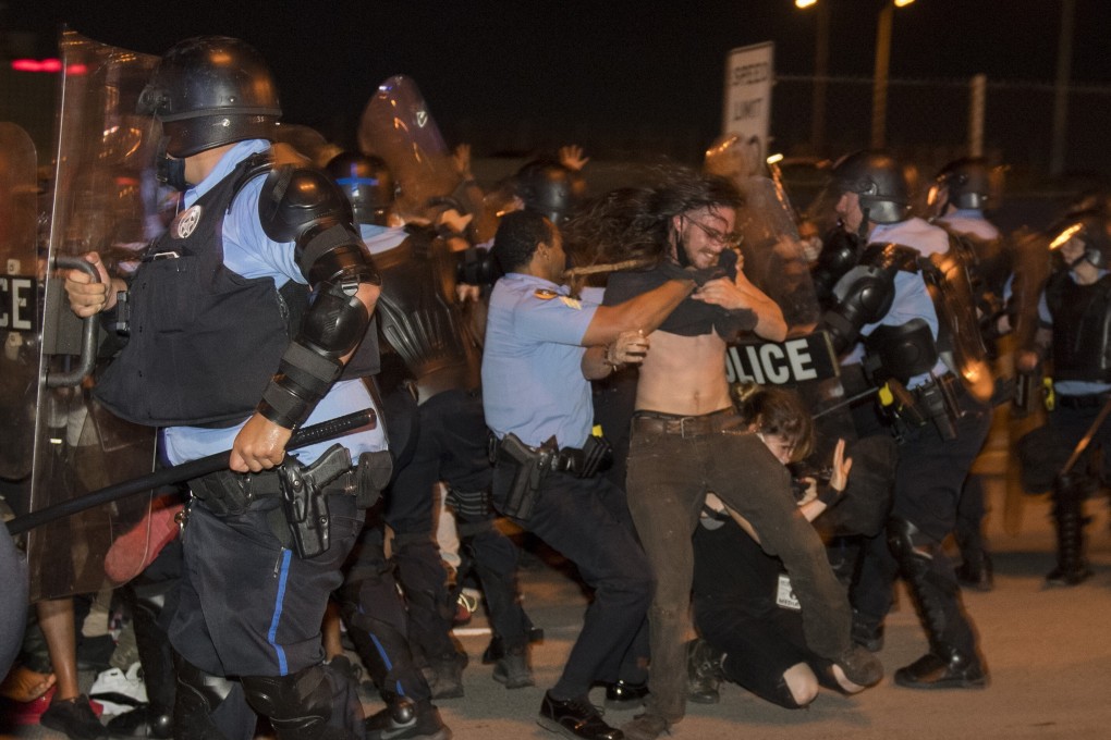 New Orleans police clash with protesters on Wednesday evening. Photo: AP