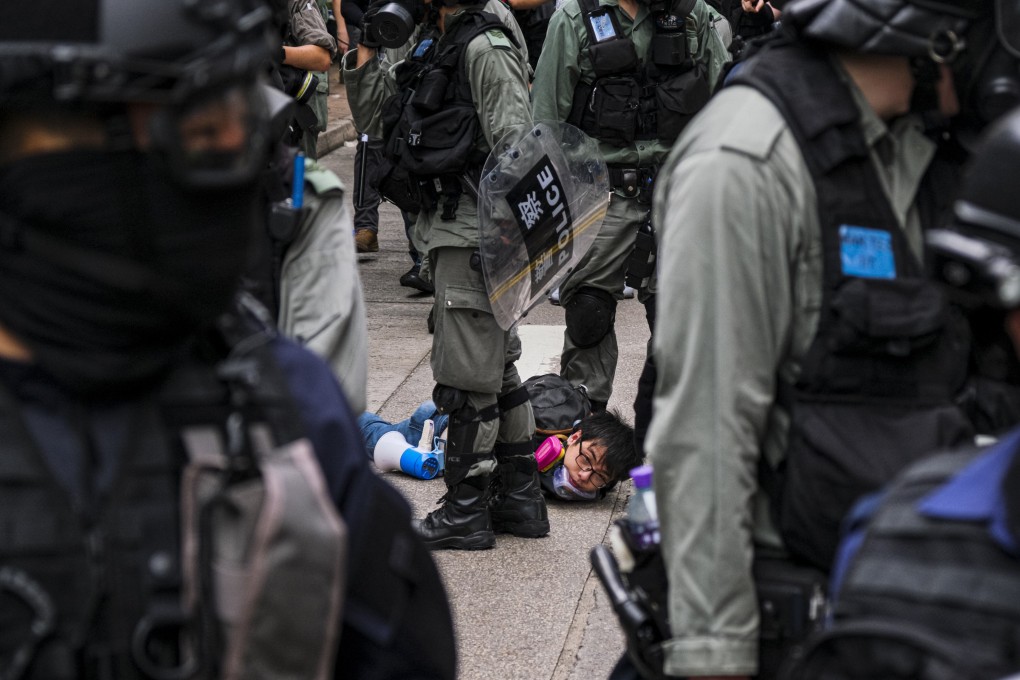 A demonstrator is arrested by police during a rally in Hong Kong on May 24 against a new national security law. Central government authorities have assured the people of the city that the new legislation will not effect the rights of law-abiding citizens. Photo: DPA