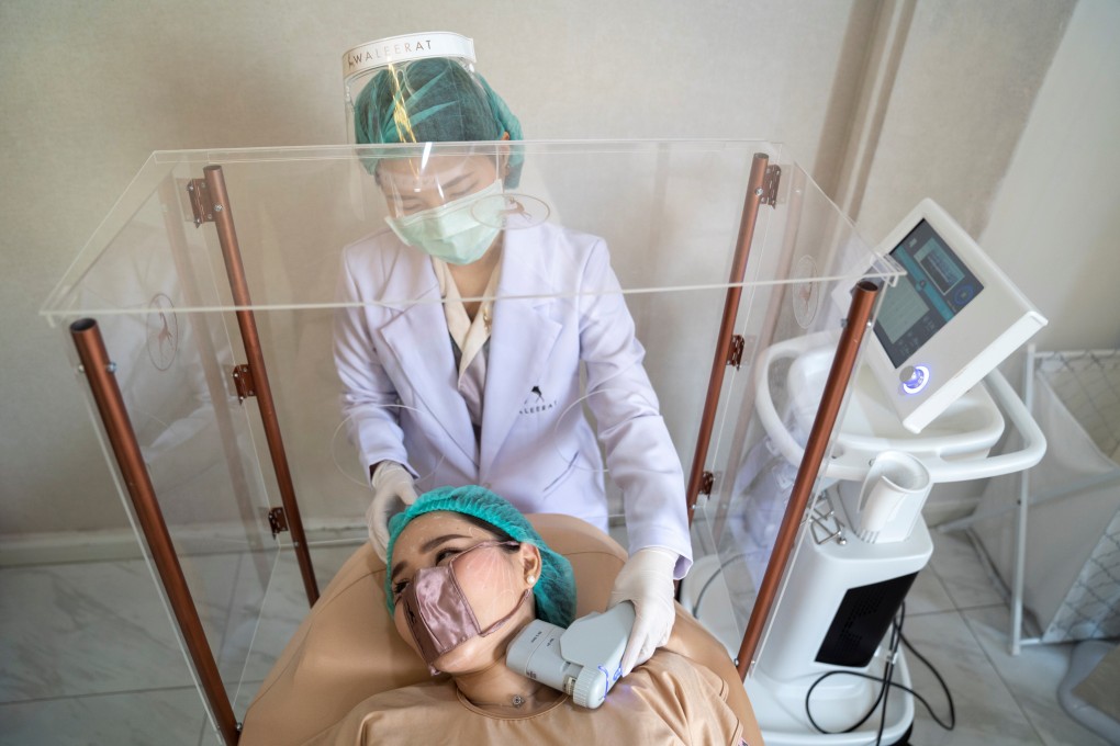 A customer wears a mini face mask during a treatment at the Waleerat beauty clinic in Bangkok. Photo: Reuters