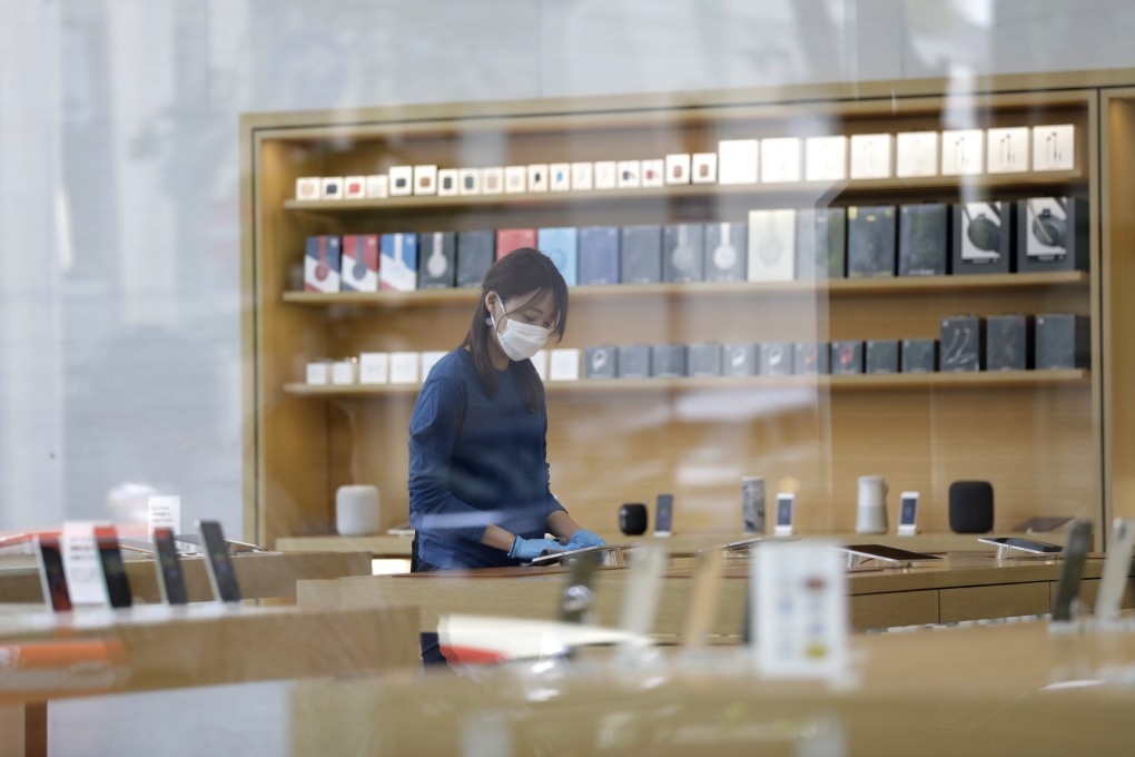An employee prepares for the reopening of an Apple Store in the Omotesando district of Tokyo, Japan, on June 3. Apple plans to release its next iPhone line multiple weeks later than usual this year. Photo: Bloomberg