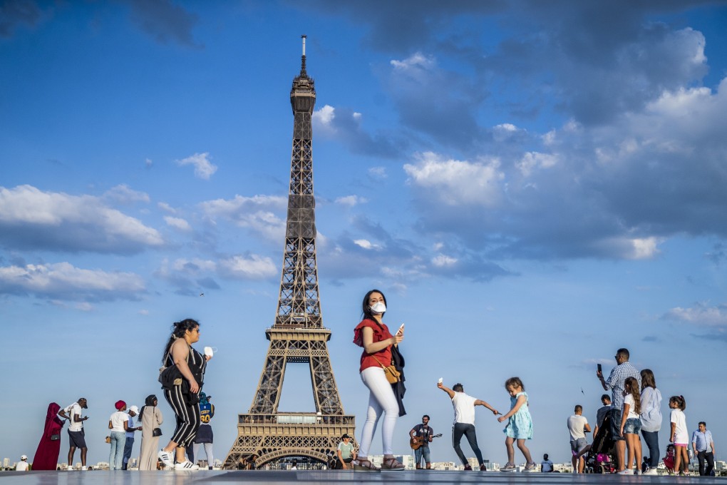 People dance to music at the Trocadero Human Rights Plaza near the Eiffel Tower in Paris on June 2. France has started a gradual lifting of Covid-19 lockdown restrictions in an effort to restart its economy and help people get back to their daily routines. Photo: EPA