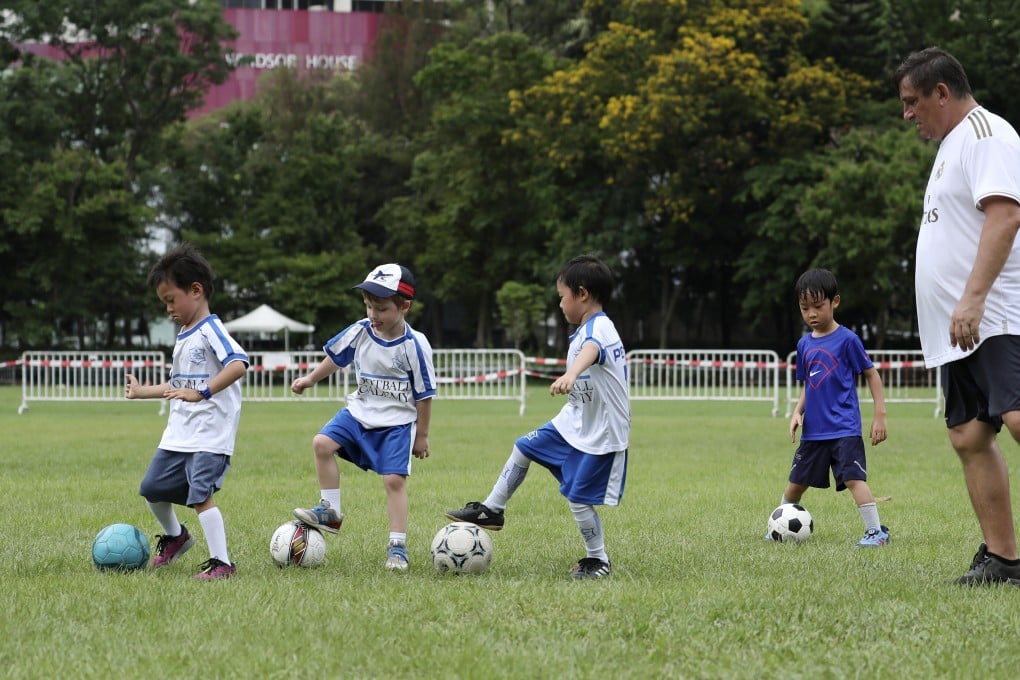 Children play in Victoria Park in Causeway Bay on May 9, as Hong Kong leisure facilities gradually reopen to the public following closures to keep Covid-19 at bay. Photo: Xiaomei Chen