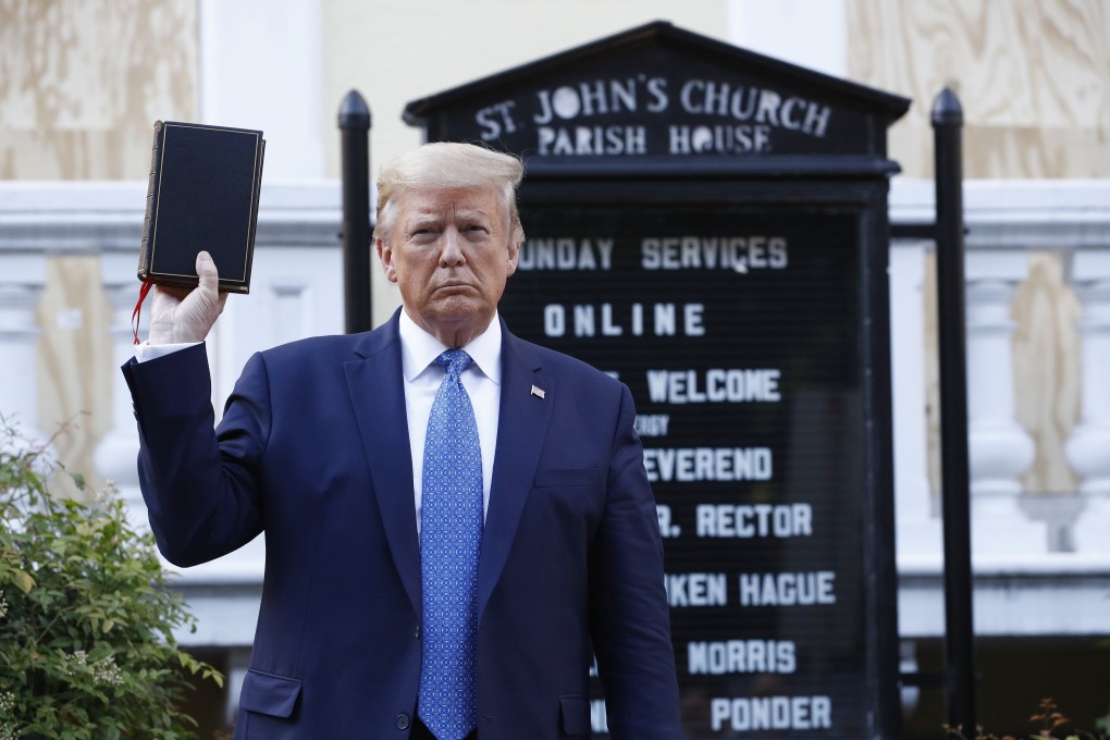 President Donald Trump poses for photographs with a Bible outside St John’s Church across Lafayette Park from the White House on June 1, amid protests over the death of George Floyd. Photo: AP