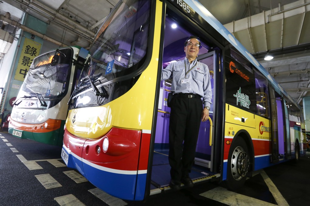 A driver poses at the gate of an electric single-decker bus in Chai Wan, as the second batch of such buses was launched in Hong Kong by Citybus and First Bus in September 2016. Photo: Jonathan Wong