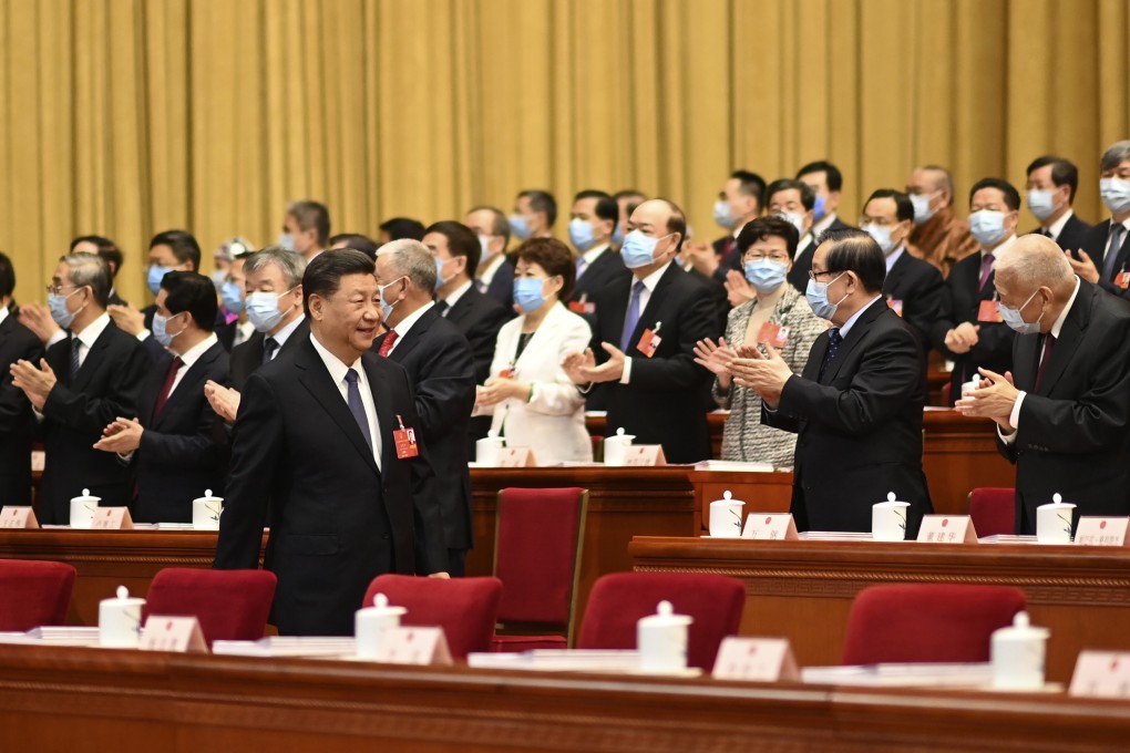 Delegates applaud as President Xi Jinping arrives for the opening session of China’s National People’s Congress at the Great Hall of the People in Beijing on May 22. Photo: Xinhua via AP