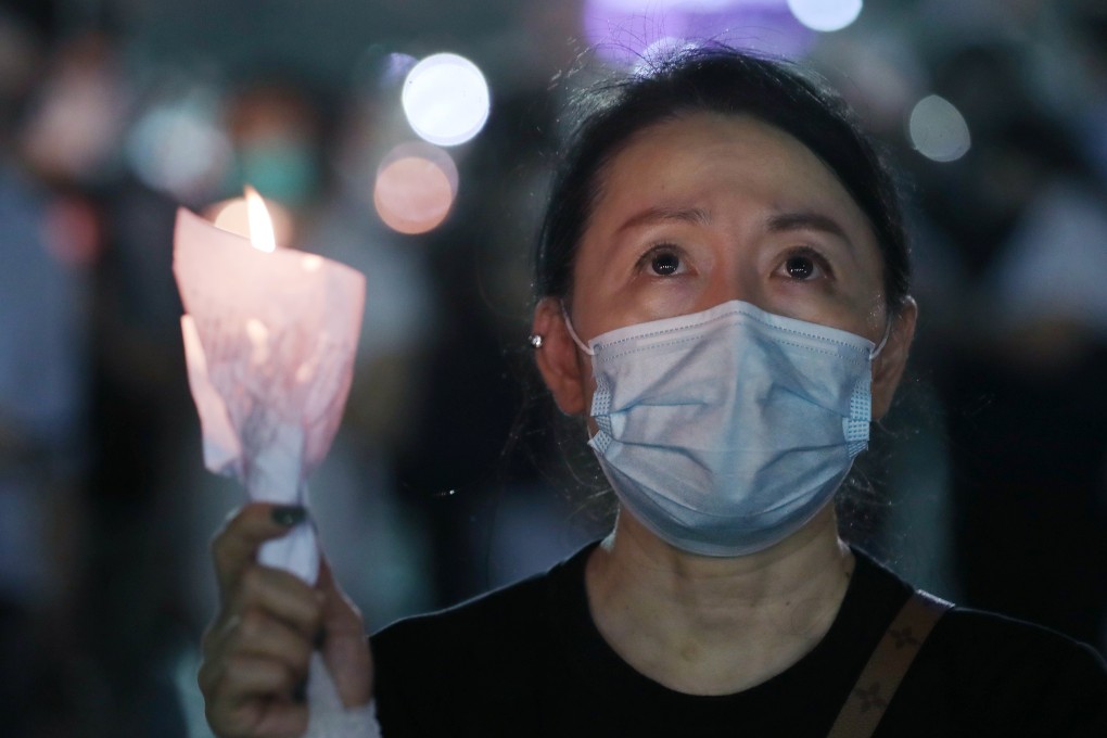 A woman joins the vigil in Victoria Park marking the 31st anniversary of the Tiananmen Square crackdown, despite a ban on the event. Photo: Sam Tsang