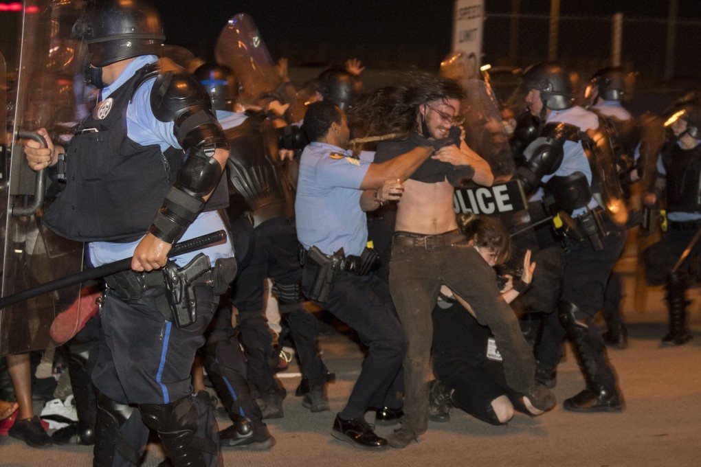 New Orleans police clash with protesters during demonstrations over the death of George Floyd. Photo: AP