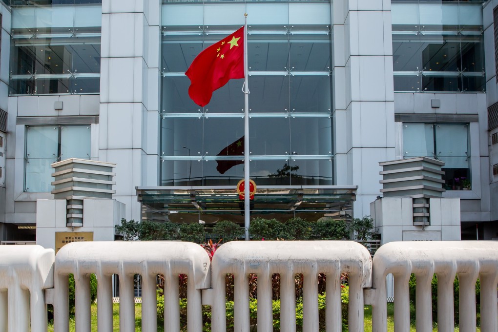 The Chinese flag, behind barriers outside the central government’s liaison office in Hong Kong in April. Photo: Bloomberg