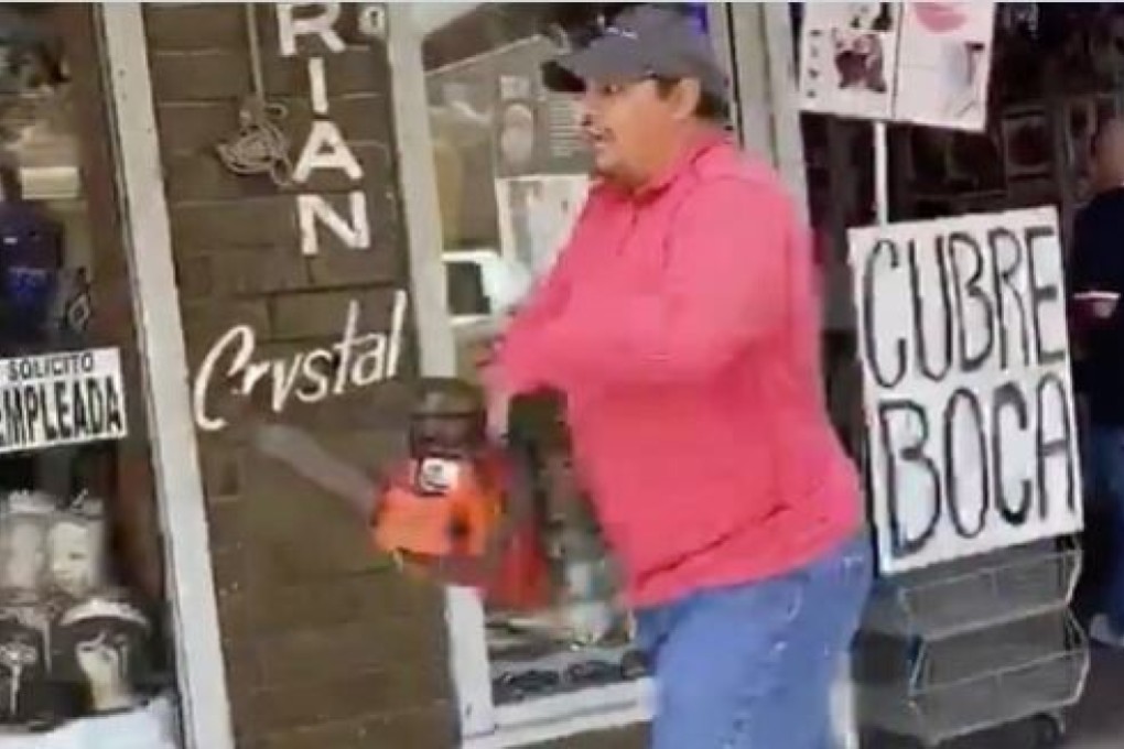 A man who wielded a chainsaw to chase away anti-racism demonstrators in Texas. Photo: Twitter