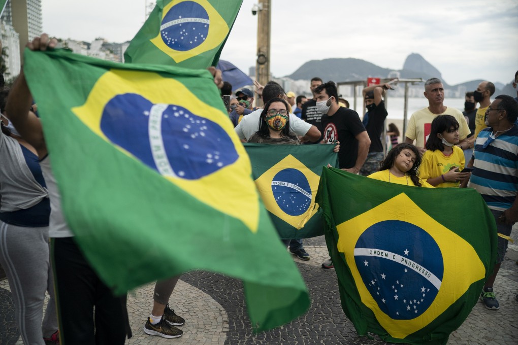 Demonstrators take part in a protest in support of Brazil’s President Jair Bolsonaro amid the coronavirus outbreak. Photo: AP Photo