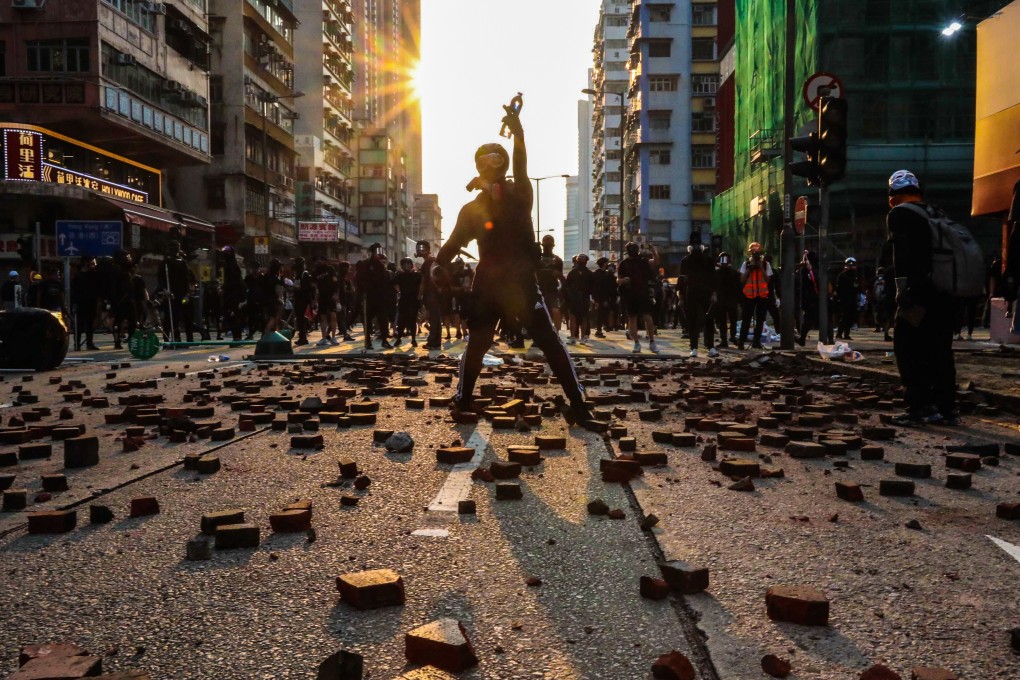 Anti-government protesters strew a street in Mong Kok with broken bricks after the police banned a planned march on October 20, 2019. Photo: Felix Wong